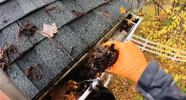 A recently cleared gutter, reducing the risk of ice dam formation on a Richmond, VA home