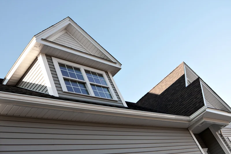 Close-up view of a home's rooftop soffit and gutter area