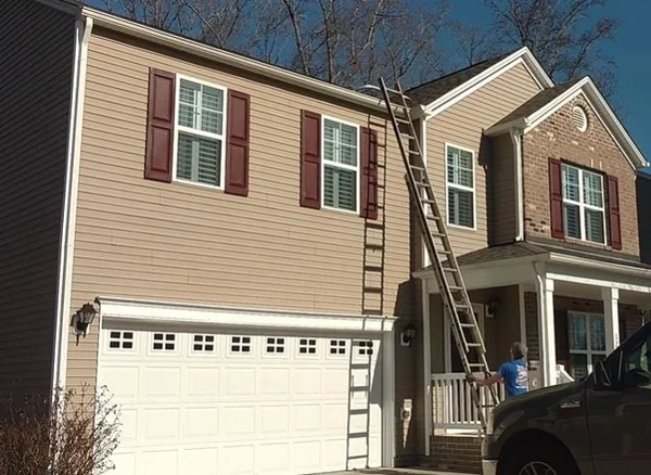 Ladder setup for gutter service during Richmond, VA's freeze-thaw season